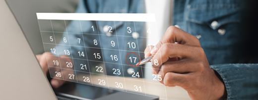 The image shows a person interacting with a digital calendar and the number 17 is circled in red. The person is using a stylus or pen on a transparent digital interface, and the calendar layout is shown clearly with dates ranging from 1 to 31.